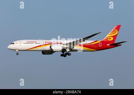 An Hainan Airlines Boeing 787-9 Dreamliner landing at Rome Fiumicino airport. Hainan Airlines is an airline headquartered in Haikou, Hainan, People's Republic of China. The airline is rated as a 5-star airline by Skytrax. It is the largest civilian-run and majority state-owned air transport company, making it the fourth-largest airline in terms of fleet size in China, and the tenth-largest airline in Asia Stock Photo