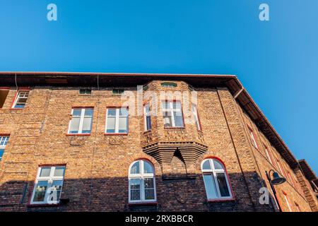 Traditional, silesian district Nikiszowiec. Renovated, old, brick block houses, build for coal miners in 1908-1919.Beautiful, afternoon light. Stock Photo