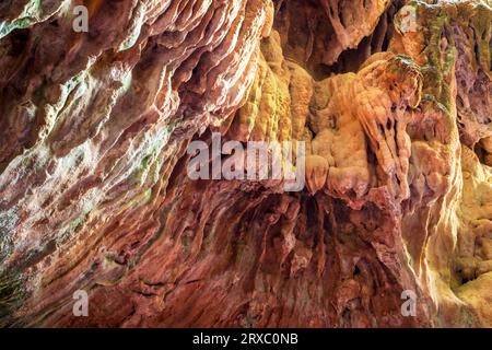 Rock formations of the Strait of La Arboleja in Aledo, Region of Murcia, Spain with water erosion forming stalactites Stock Photo