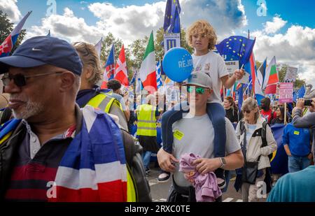 London, UK. 23 Sep 2023: A father carries his young son on his shoulders at the EU National Rejoin March in central London. Thousands of people marche