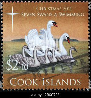 Twelve days of Christmas - 7 swans a swimming on postage stamp of Cook Islands Stock Photo