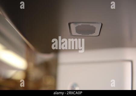 Speaker in the ceiling above the train door, close-up Stock Photo