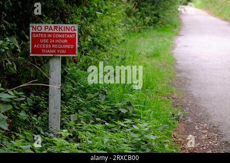 July 2023 - No Parking sign in a country lane to allow access through gates Stock Photo