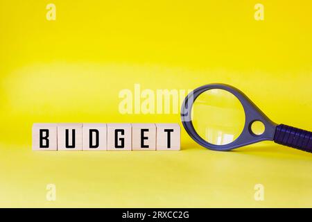 Budget. The cubes form the words Budget on a yellow background. Budget planning concept Stock Photo