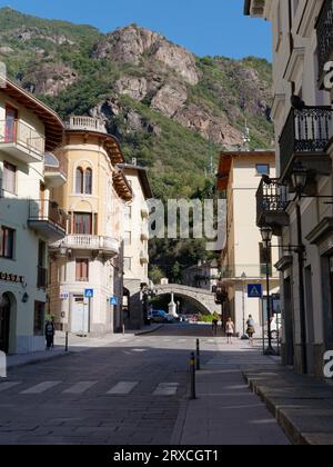 Pont-Saint-Martin high street and Roman Bridge (Where the town gets its name from) in the Aosta Valley Region NW Italy, September 24, 2023 Stock Photo