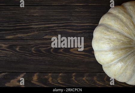 Vintage wood texture background for Halloween theme, top view. Dark brown wooden planks and white pumpkin, ripe vegetable. Hallowen, thanksgiving, foo Stock Photo