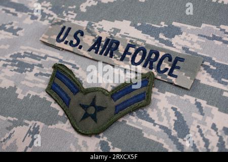 August 31, 2020. US AIR FORCE branch tape and Airman First Class rank patch on digital tiger-stripe pattern Airman Battle Uniform background Stock Photo