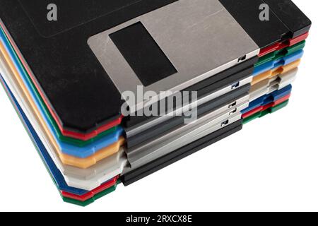 Colored old retro floppy diskettes in stack. Isolated on white background. Stock Photo