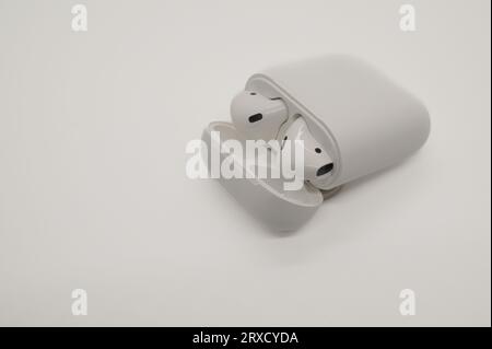 wireless earbuds in a case on a white background Stock Photo