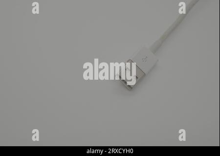 white USB cable isolated on a grey background Stock Photo
