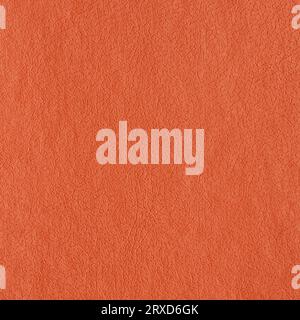 Synthetic orange color leather for background. Close-up detail view of art image texture decoration material, orange pattern background for design Stock Photo