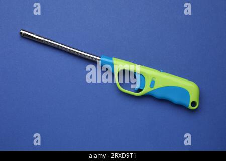 One gas lighter on blue background, top view Stock Photo