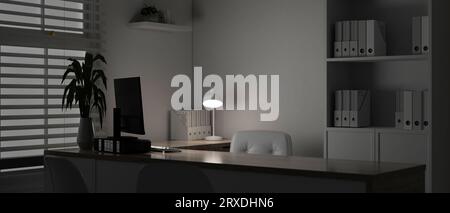 A modern white doctor's office or private office at night with a computer on a table, office supplies, a shelf, a window with window blinds, a table l Stock Photo