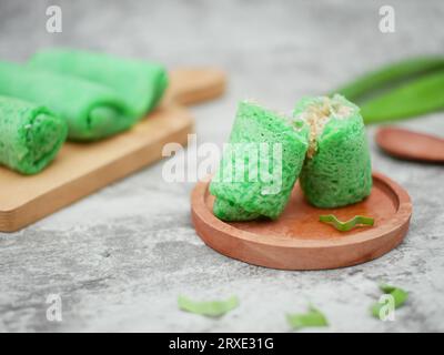 dadar gulung or sweet coconut pancakes from Indonesia, made from flour with grated coconut mixed with palm sugar Stock Photo