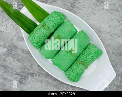 dadar gulung or sweet coconut pancakes from Indonesia, made from flour with grated coconut mixed with palm sugar Stock Photo