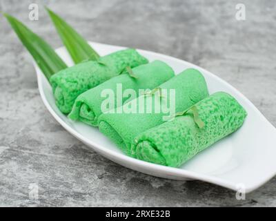 dadar gulung or sweet coconut pancakes from Indonesia, made from flour with grated coconut mixed with palm sugar Stock Photo