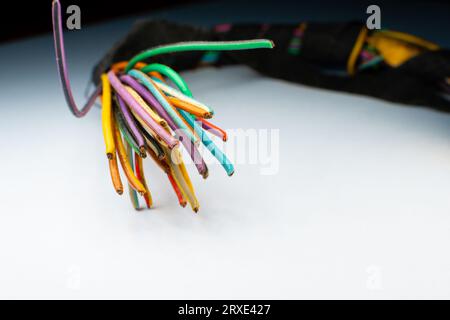 Cut off car electrical wiring from the sensor, close-up. Small multi-colored copper wires Stock Photo