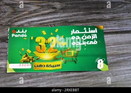 Cairo, Egypt, September 11 2023: Panda supermarket 32nd anniversary coupon for an opportunity of winning one of 32 gold bars and free trolly, the annu Stock Photo