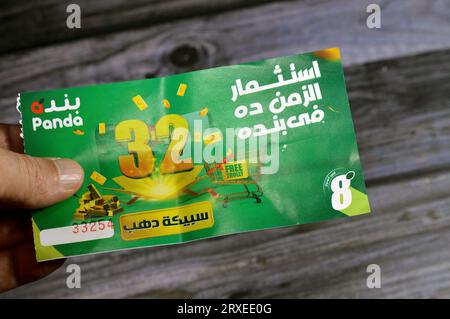 Cairo, Egypt, September 11 2023: Panda supermarket 32nd anniversary coupon for an opportunity of winning one of 32 gold bars and free trolly, the annu Stock Photo