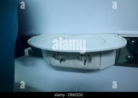 interior inside an executive train. electric plugs. drinking stand. Stock Photo
