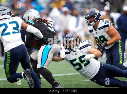 Seattle Seahawks linebacker Jon Rhattigan (59) arrives on the field along  with offensive tackle Jake Curhan (74) and defensive end Dre'Mont Jones  (55) before the NFL football team's mock game, Friday, Aug.