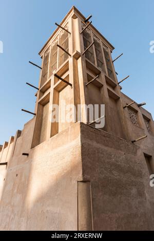 Restored wind tower in historic Souk Bastakia, showcasing ancient air ventilation ingenious system, Dubai, United Arab Emirates Stock Photo