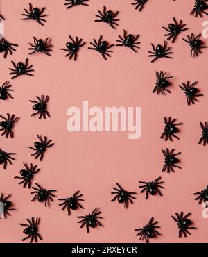 Group of black toy spiders on a orange background for halloween Stock ...