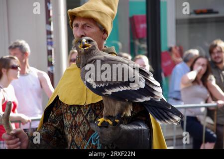 August 19, 2012. Charcter with a bird of prey in The Procession of the Golden Tree Pageant, held every 5 years since 1958. Bruges, Belgium. Stock Photo