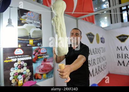 (230925) -- ANKARA, Sept. 25, 2023 (Xinhua) -- A vendor prepares ice cream for customers at the Ice Cream and Dessert Festival in Ankara, T¨¹rkiye, on Sept. 24, 2023. (Mustafa Kaya/Handout via Xinhua) Stock Photo