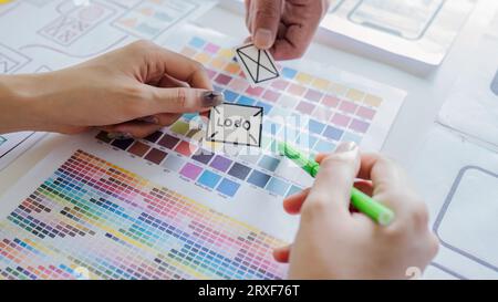 team of UI UX web designer are working together to develop mobile responsive websites with UI UX front end designer previews Stock Photo