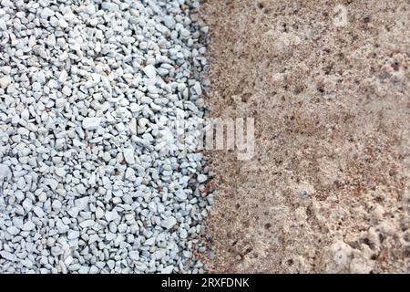 construction materials limeStone and sand background. gravel and macadam. Industrial fraction Crushed gray fines top view Stock Photo