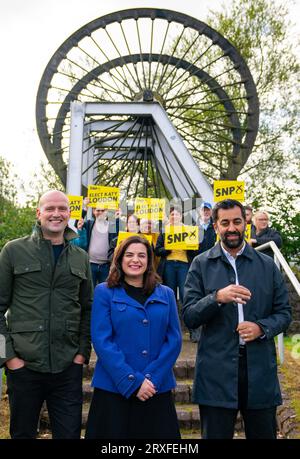 Glasgow, Scotland, UK. 25th September 2023. First Minister and SNP Leader, Humza Yousaf joins SNP Westminster Leader, Stephen Flynn and SNP candidate Katy Loudon at the Cambuslang Miners Monument today ahead of the Rutherglen and Hamilton West by-election which will be held on 5th October.   Iain Masterton/Alamy Live News Stock Photo