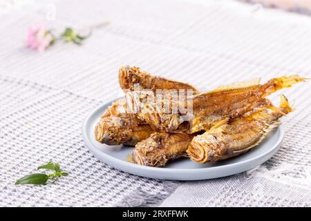 Deep-fried Small Yellow Croakers with spicy salt Stock Photo