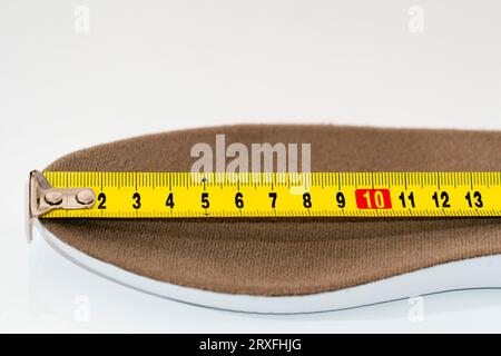 Shoe size measurement. Measure tape measure insoles. shoes size concept. close-up.  measure footwear scale . footwear Size Guide Stock Photo