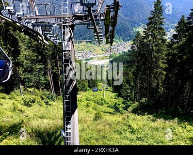 Chair lift departing from the town of Auronzo, in two sections it takes you to the top of the 1585 meter high Mount Agudo Stock Photo