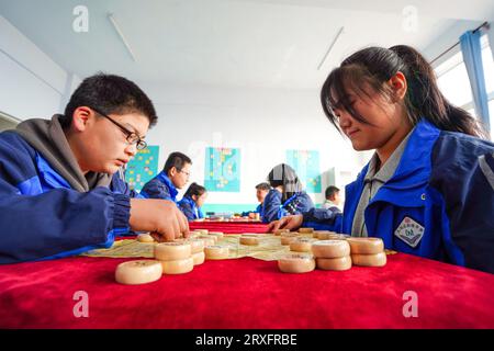 Luannan, China - March 9, 2023: The students are learning Chinese chess in the classroom, North China Stock Photo