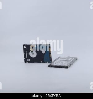 Two broken laptop hard drives isolated on a white background Stock Photo