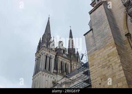 Angers, France, 2023. The back of the bell towers (Gothic left and right, framing the Renaissance tower in centre) of Saint-Maurice Cathedral Stock Photo