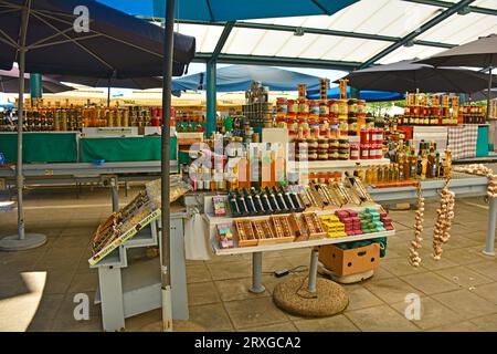 Rovinj, Croatia - July 9th 2023. A small outdoor market in Rovinj old town in Istria, Croatia. It sells fruit, vegetables and souvenirs such as honey Stock Photo