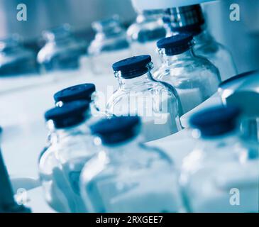 Medicine bottles, vials, in the filling machine Digital image Stock Photo