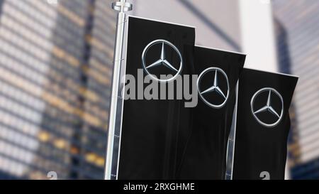 Stuttgart, DE, Aug 20 2023: Three black vertical banners with Mercedes logo waving in the wind. German luxury and commercial vehicle automotive brand. Stock Photo