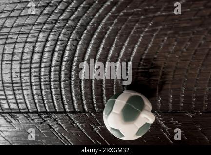 A toy soccer ball on a wooden table Stock Photo