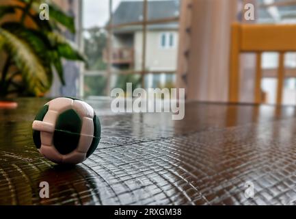 A toy soccer ball on a wooden table Stock Photo