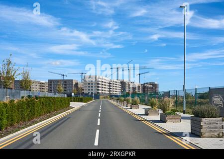 Barking Riverside housing development under construction, Greater London UK, looking East along Project Road Stock Photo