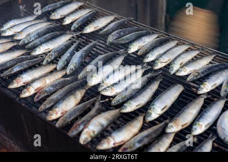 grilling sardines outdoor on the street in Porto Portugal . Stock Photo