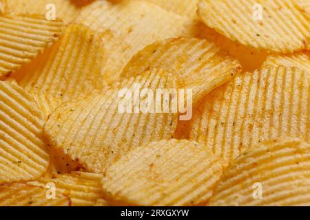 Lots of potato chips, texture close up Stock Photo