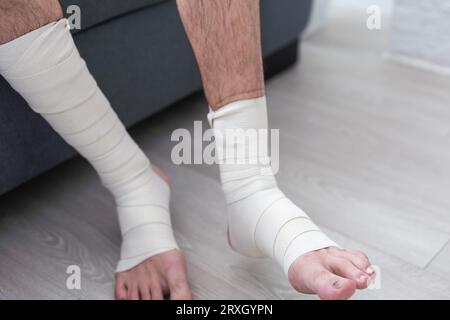 man using put on elastic bandage with legs having leg pain Stock Photo