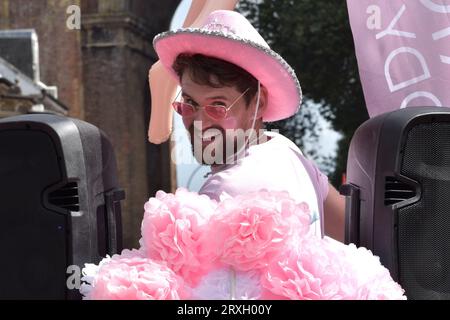 Brighton and Hove, United Kingdom, August 4 2018: smiling man with a beard wearing pink hat during during Annual Pride parade Stock Photo