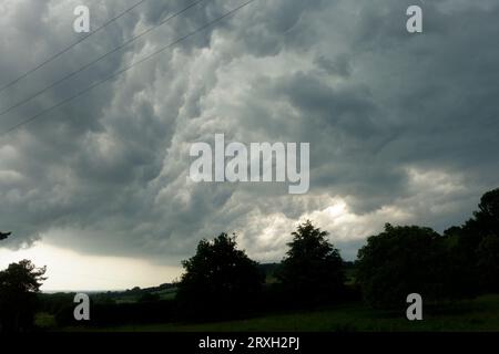 Dark storm clouds over Meon Hill near Mickleton Chipping Campden UK Stock Photo