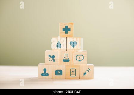 Medical symbols on wooden blocks stacked Stock Photo